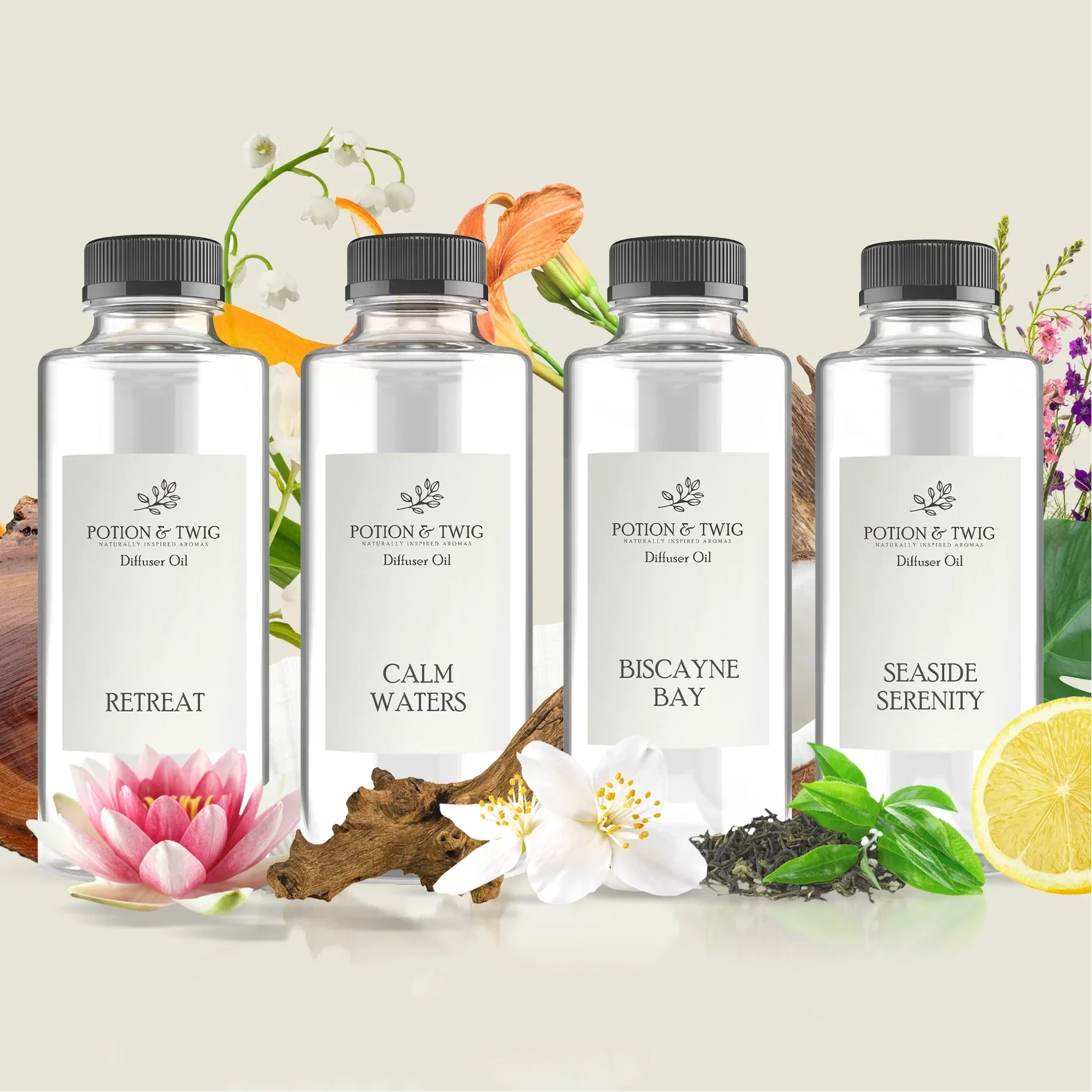 Four bottles of Potion & Twig diffuser oil with floral and natural elements on a light background