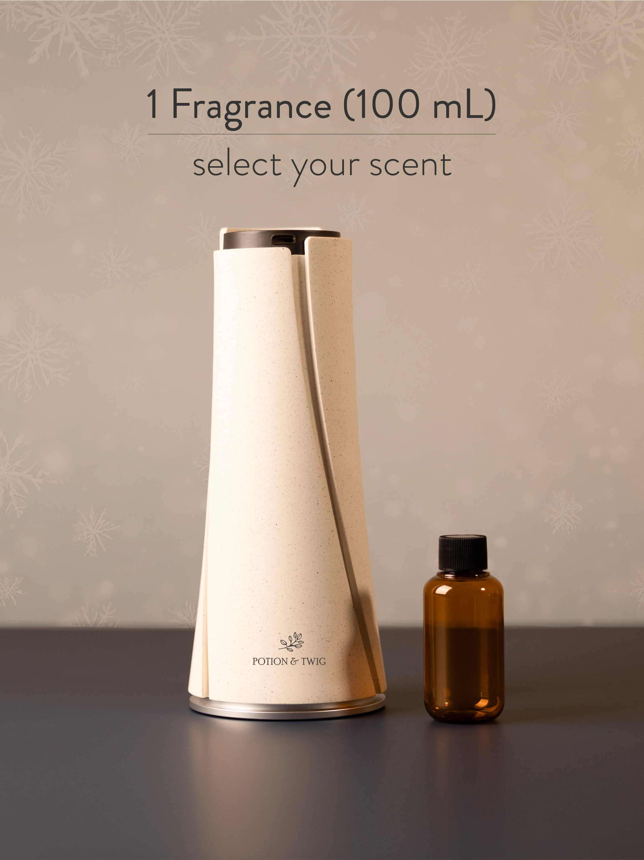 White cylindrical fragrance diffuser and small brown bottle on a dark surface with a neutral background.