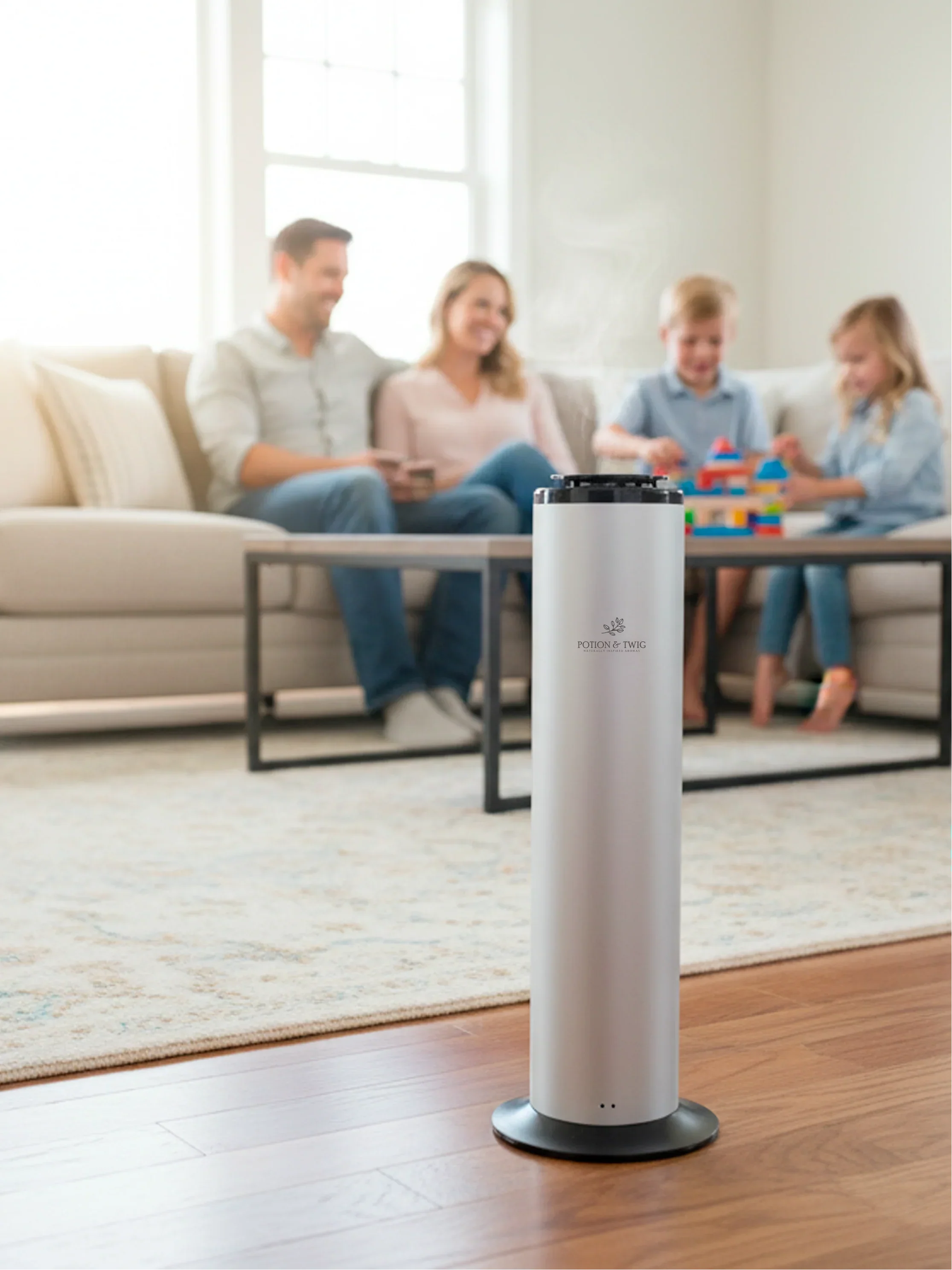 Terra Diffuser smart tower for large space scenting with a family sitting on the couch in the background