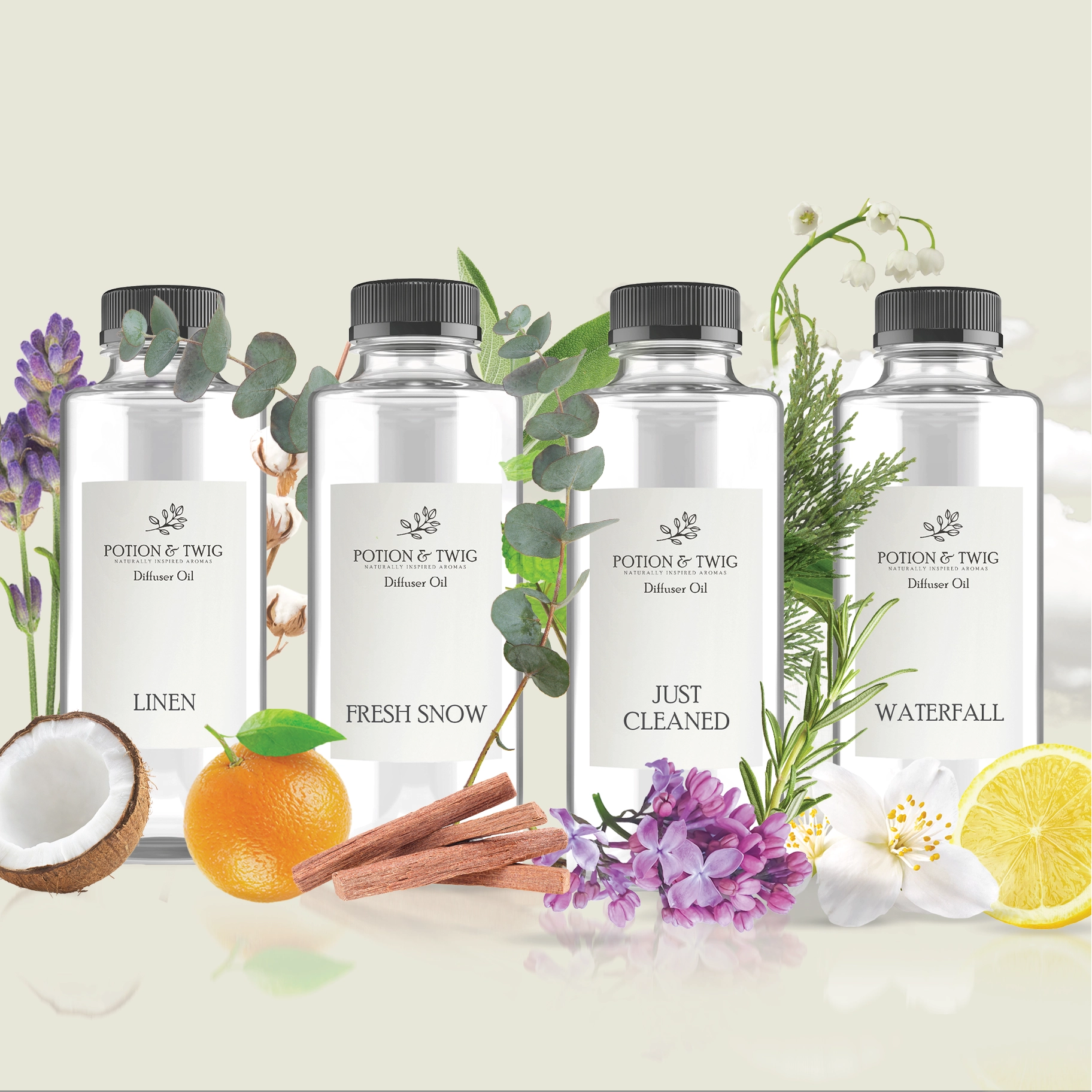 Four bottles of Potion & Twig diffuser oil with labels "Linen", "Fresh Snow", "Just Cleaned", "Waterfall" with scent notes in the background
