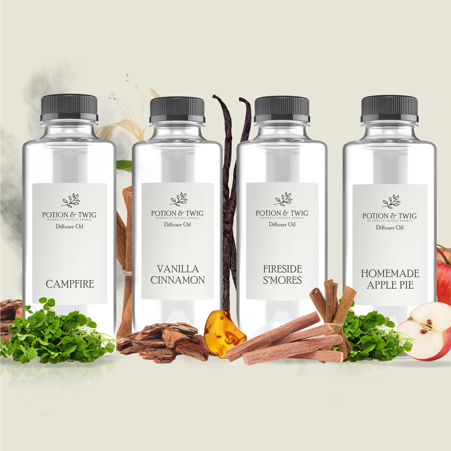 Four bottles of Potion & Twig diffuser oil with labels for Campfire, Vanilla Cinnamon, Fireside S'mores, and Homemade Apple Pie.