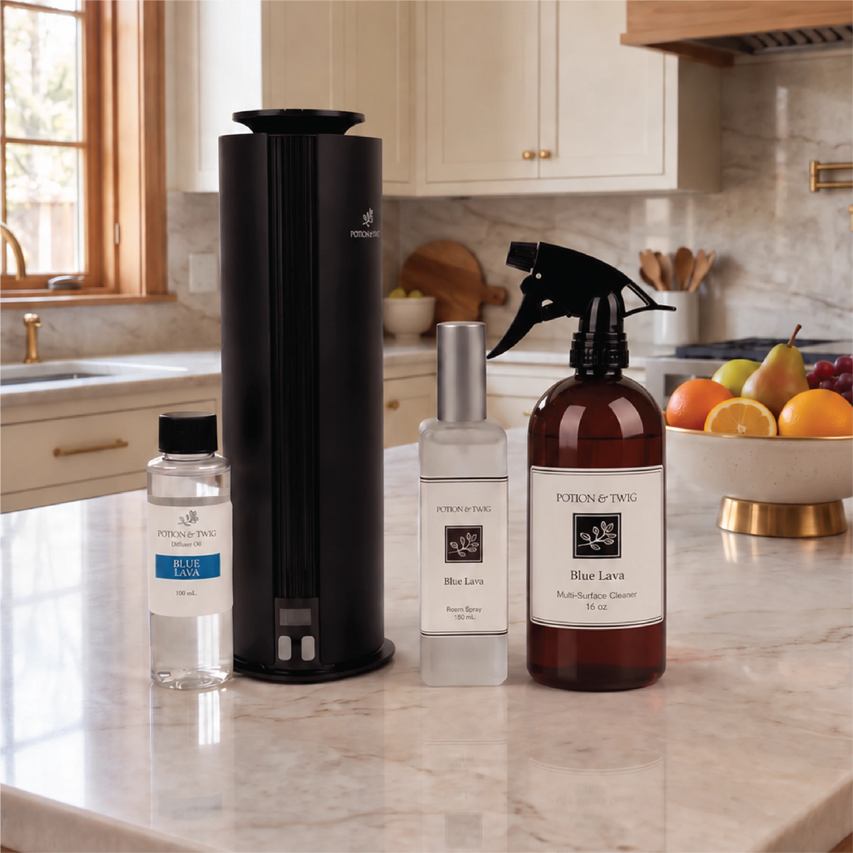 Four Potion & Twig products, featuring a Blue Lava 16 oz Multi-Surface cleaner, Blue Lava 130mL room spray, a spire diffuser with a Blue Lava 100mL oil bottle sitting on a countertop in a kitchen.