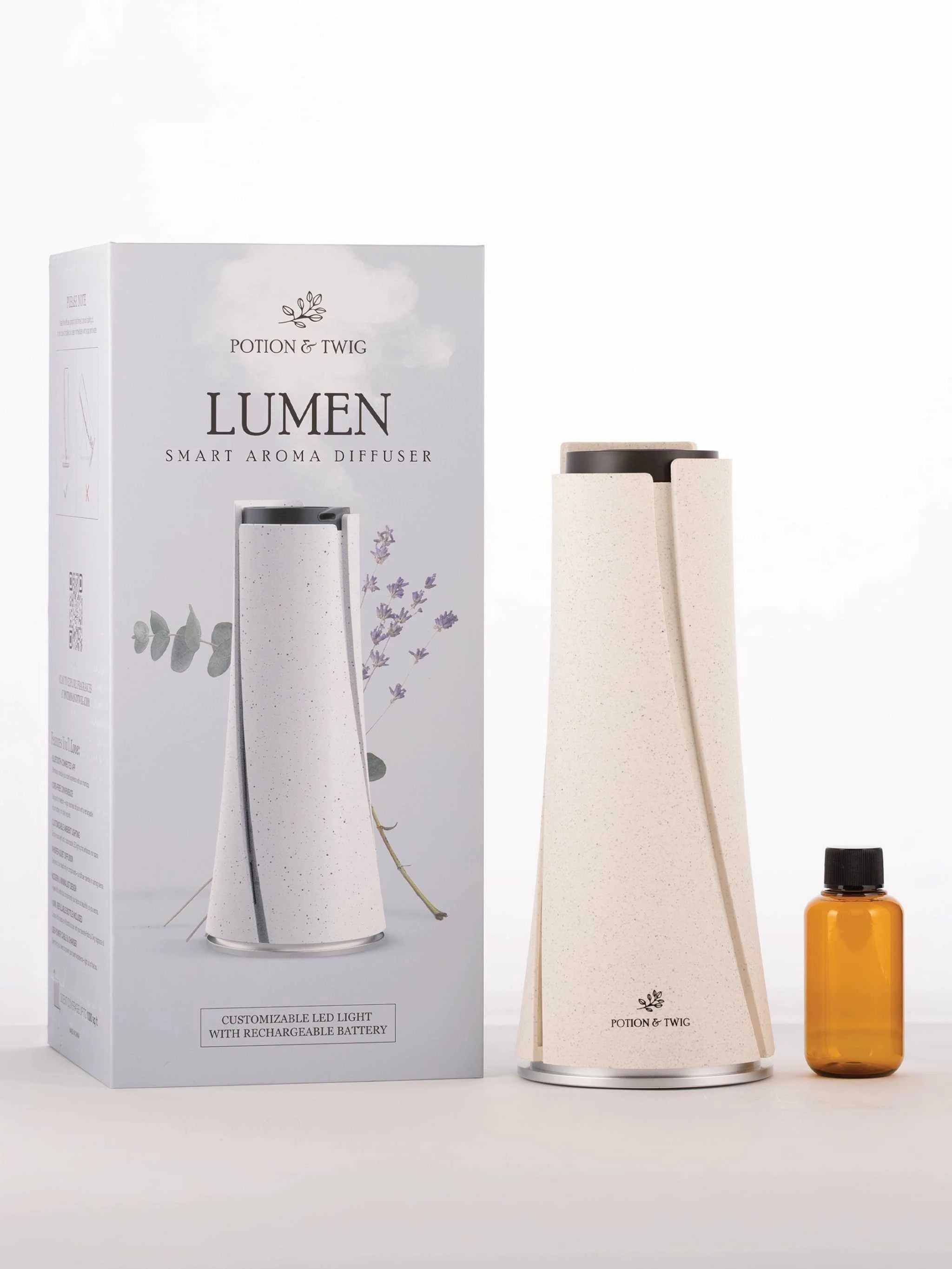 Lumen smart aroma diffuser with packaging and a small bottle on a white background