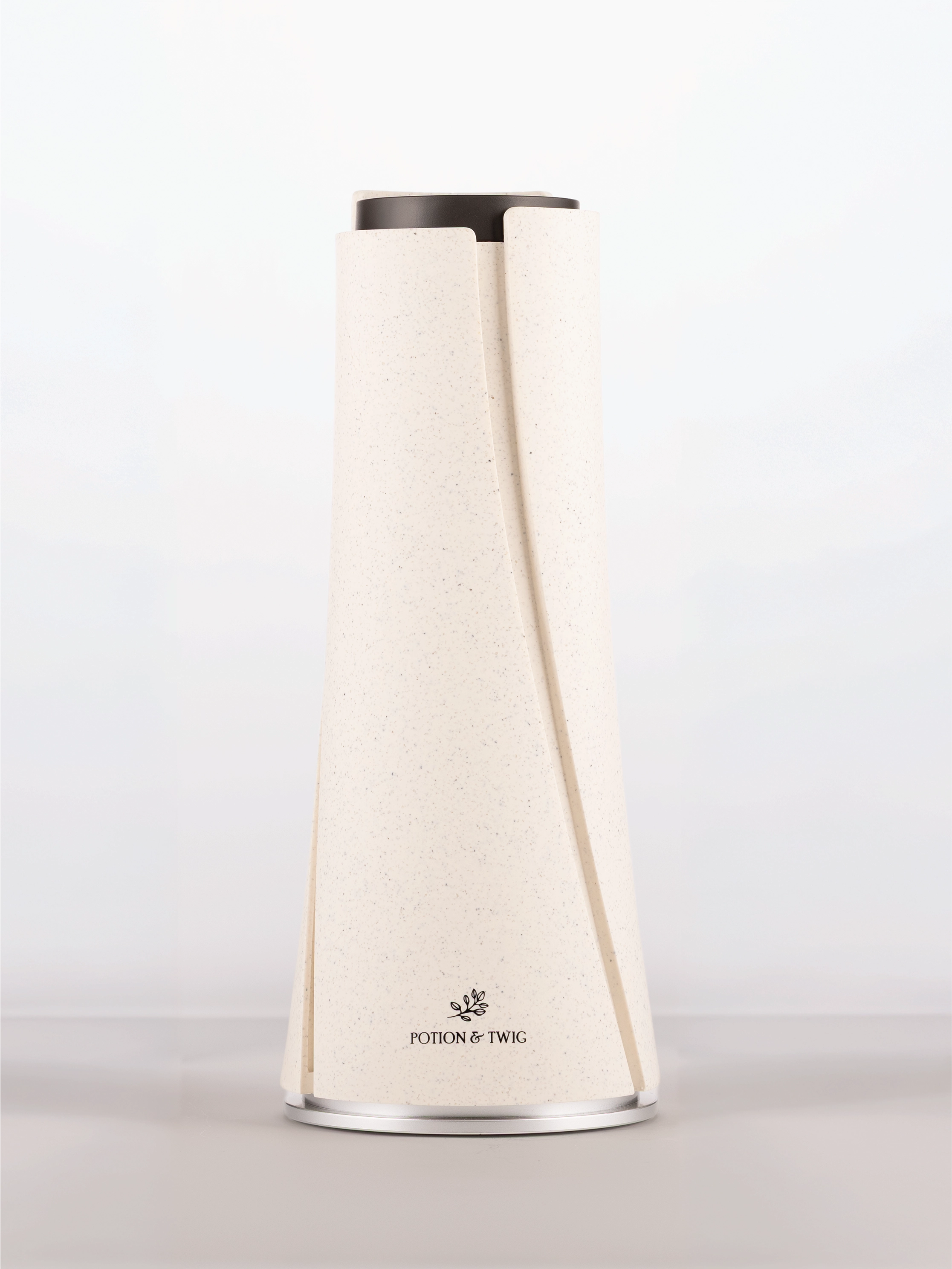 White cylindrical scent diffuser with 'Potion & Twig' brand logo on a white background