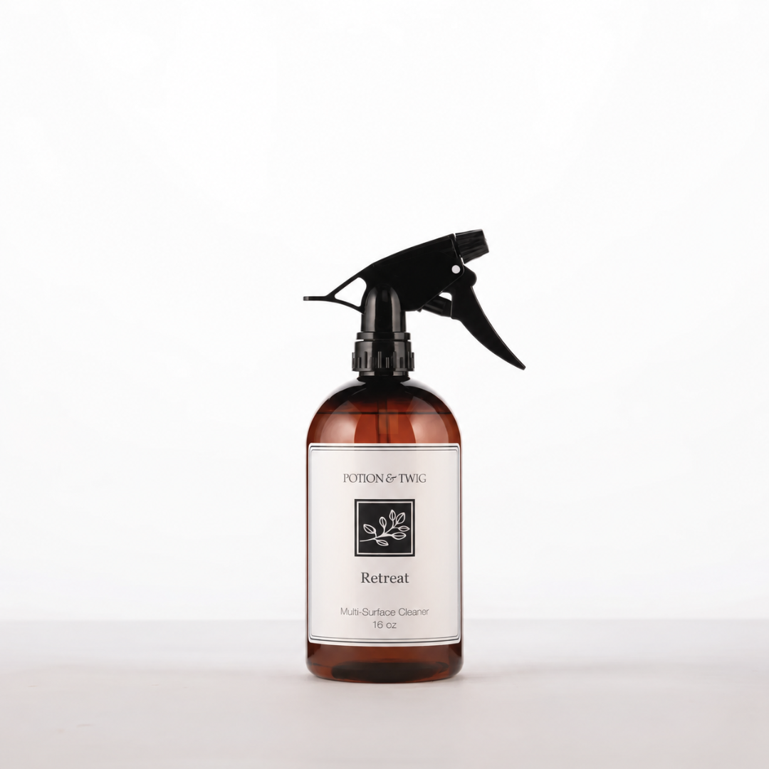 16oz Multi-surface cleaner bottle branded Potion & Twig and labeled Retreat on a white background