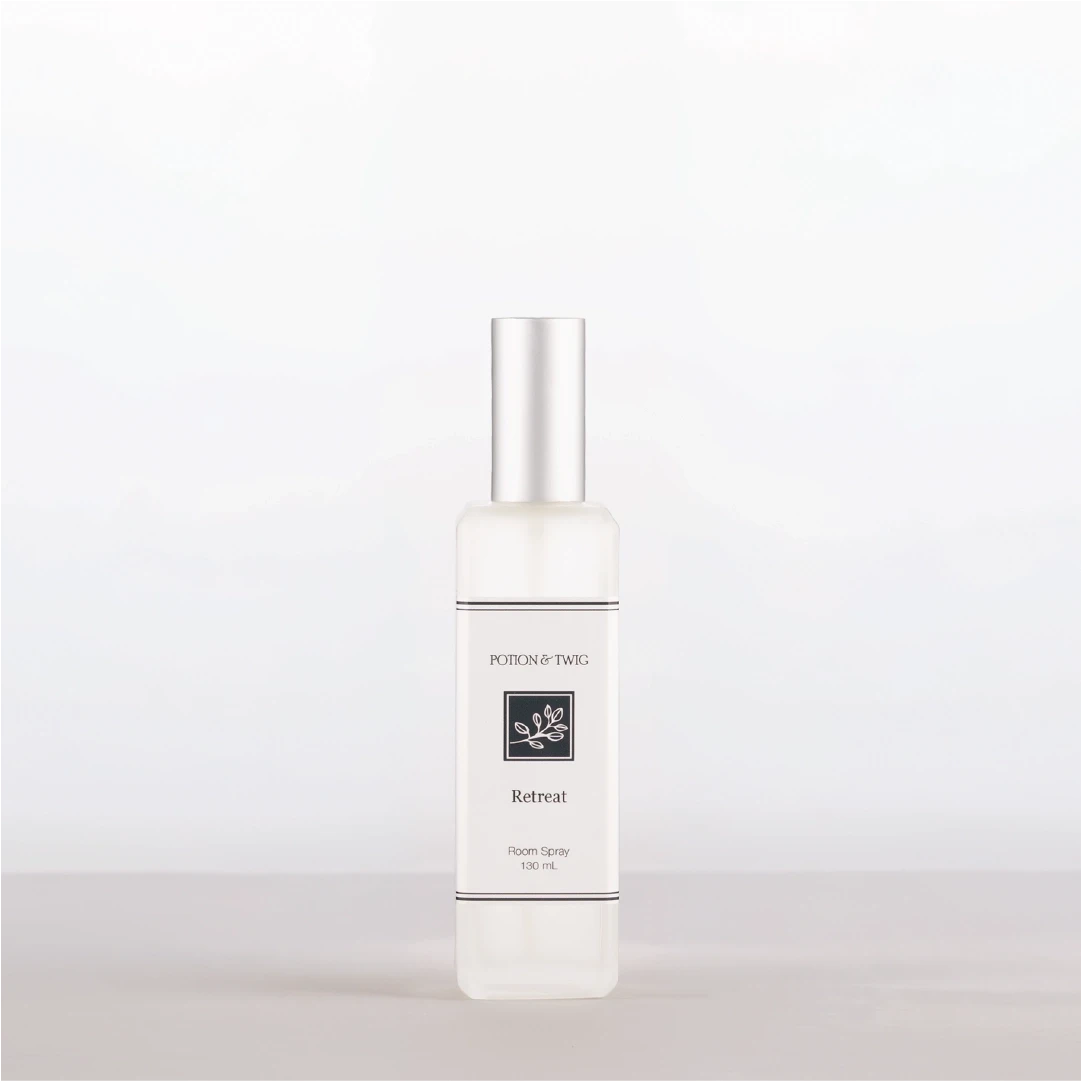 Room Spray bottle labeled 'Retreat' by Potion & Twig on a white background