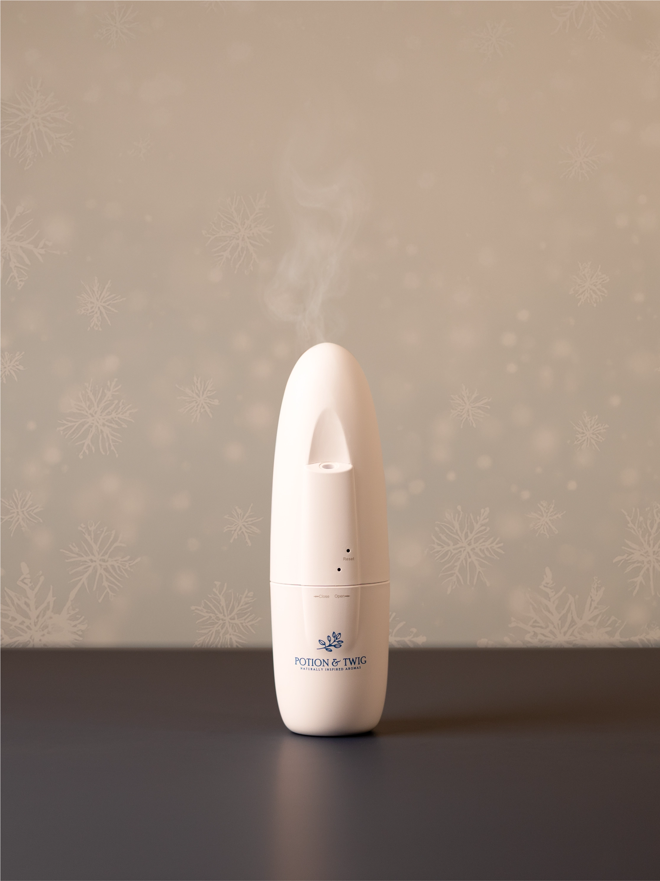 White Sienna wall plug in scent diffuser on light neutral background