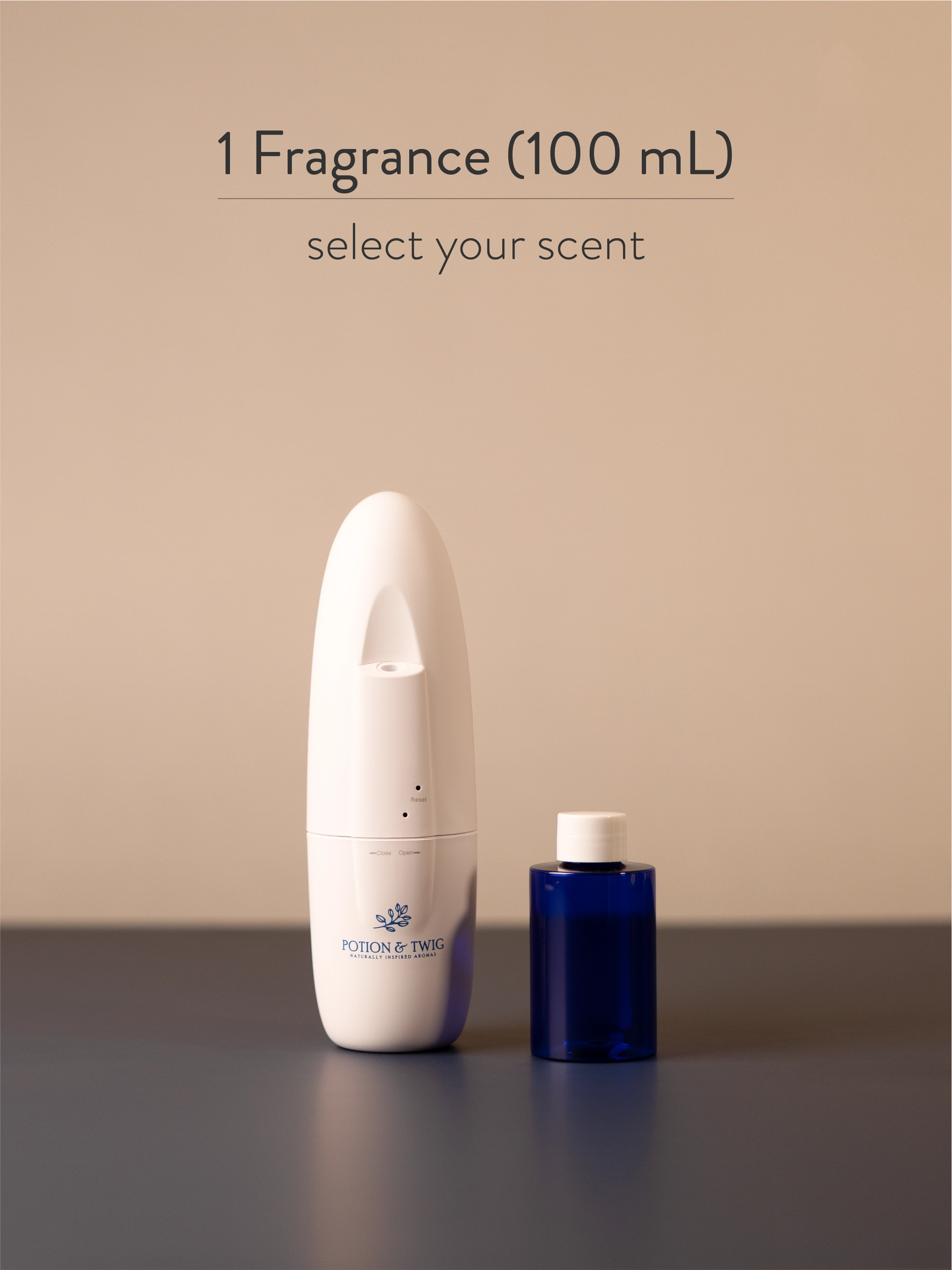 White Sienna scent diffuser next to a bottle of fragrance oil.