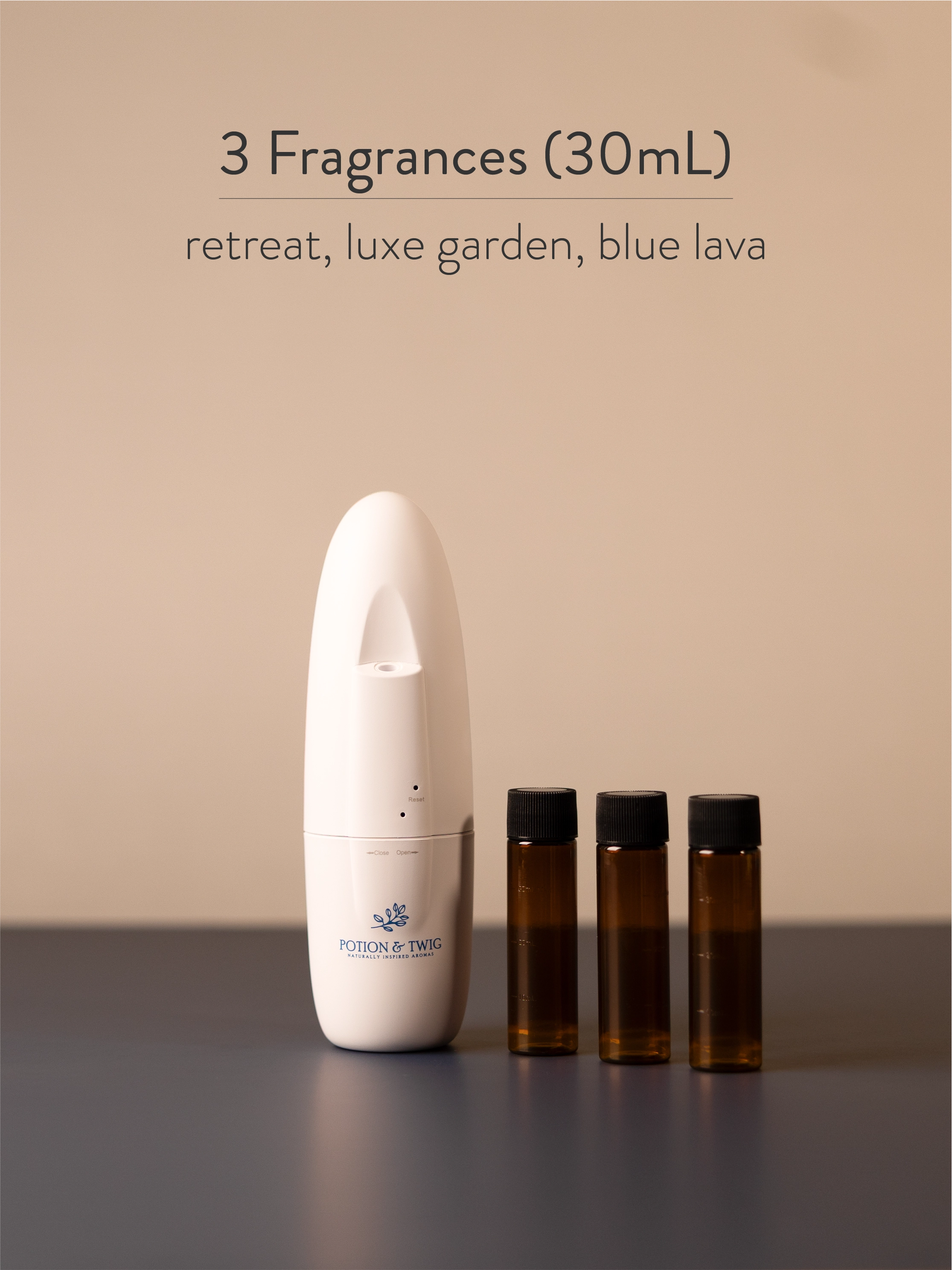 White Sienna scent diffuser next to 3 bottles of fragrance oil.