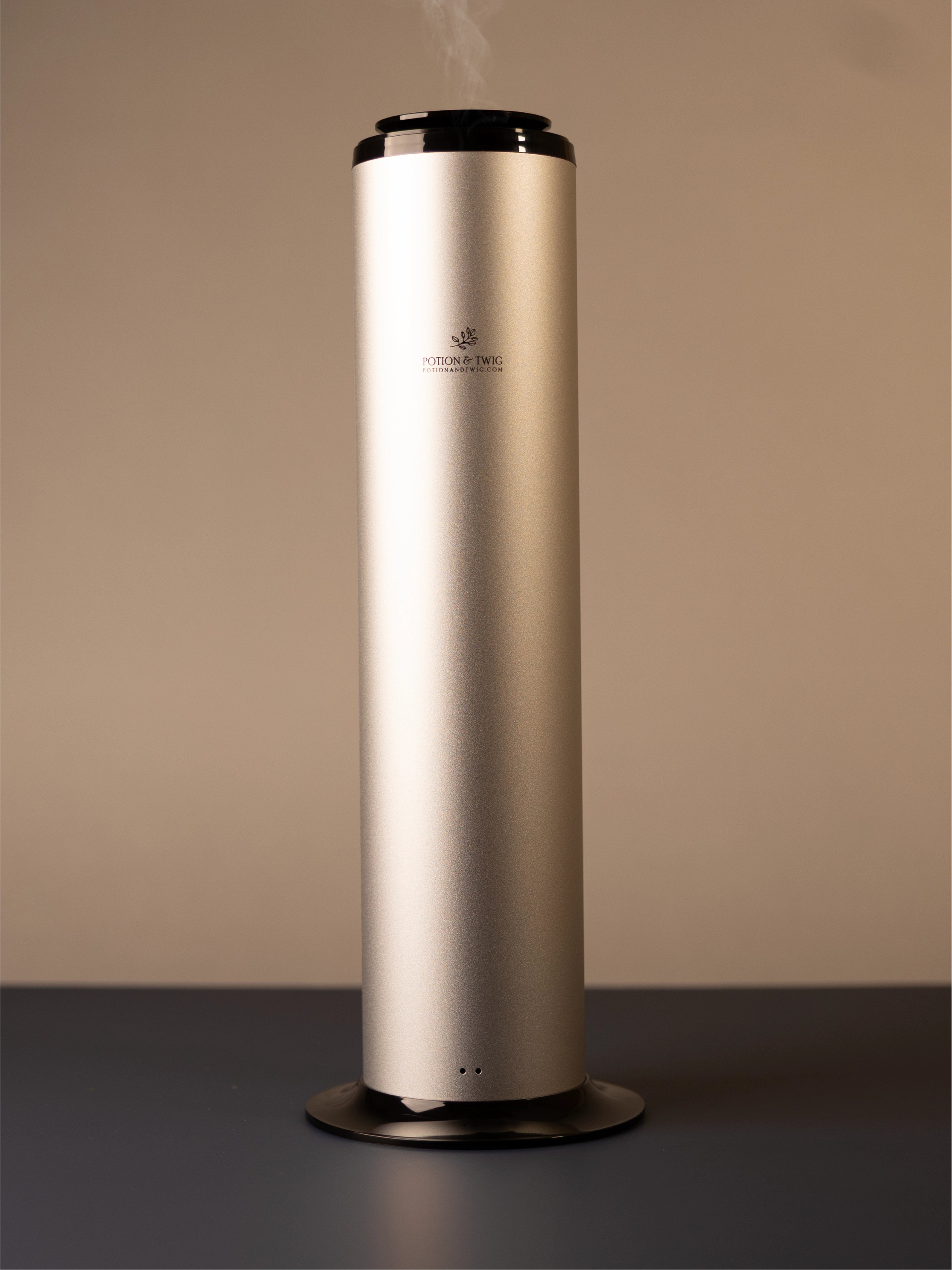 Tall cylindrical Terra scent diffuser on light neutral background