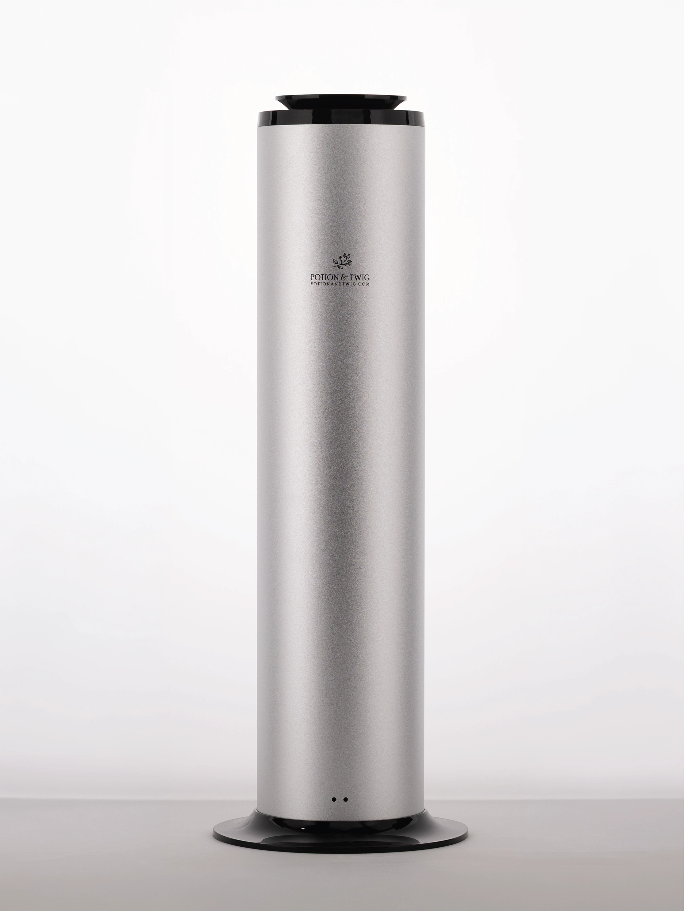 Tall cylindrical silver scent diffuser with 'Potion & Twig' logo branding on a white background