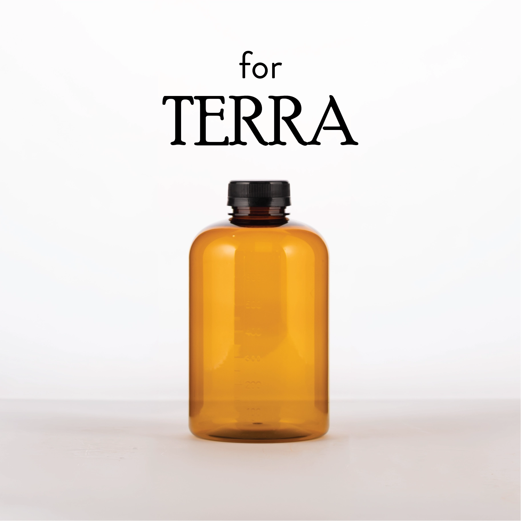 Amber glass bottle with black cap on a white background, branded 'TERRA'.