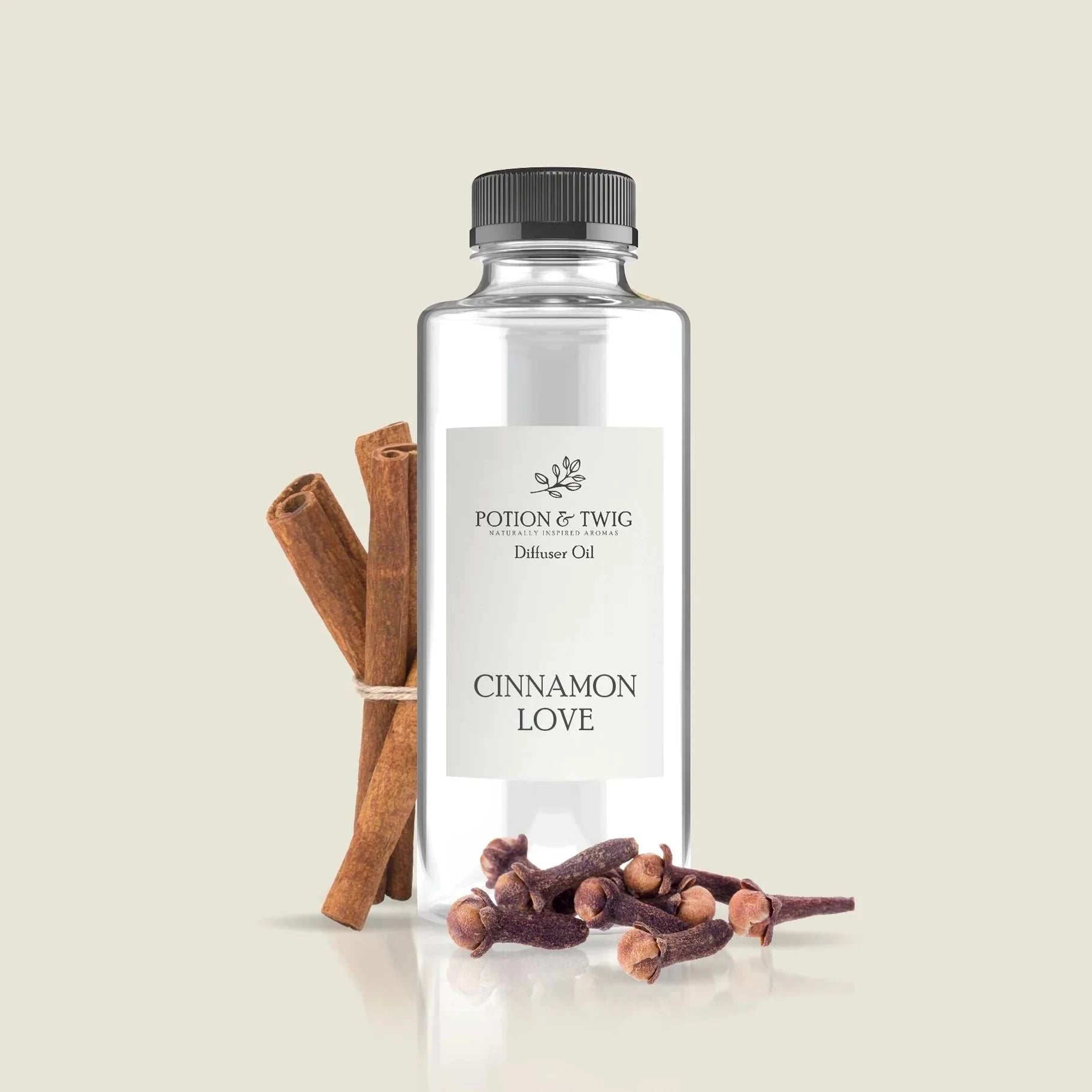 Close-up of warm cinnamon sticks and rose petals symbolizing Cinnamon Love fragrance