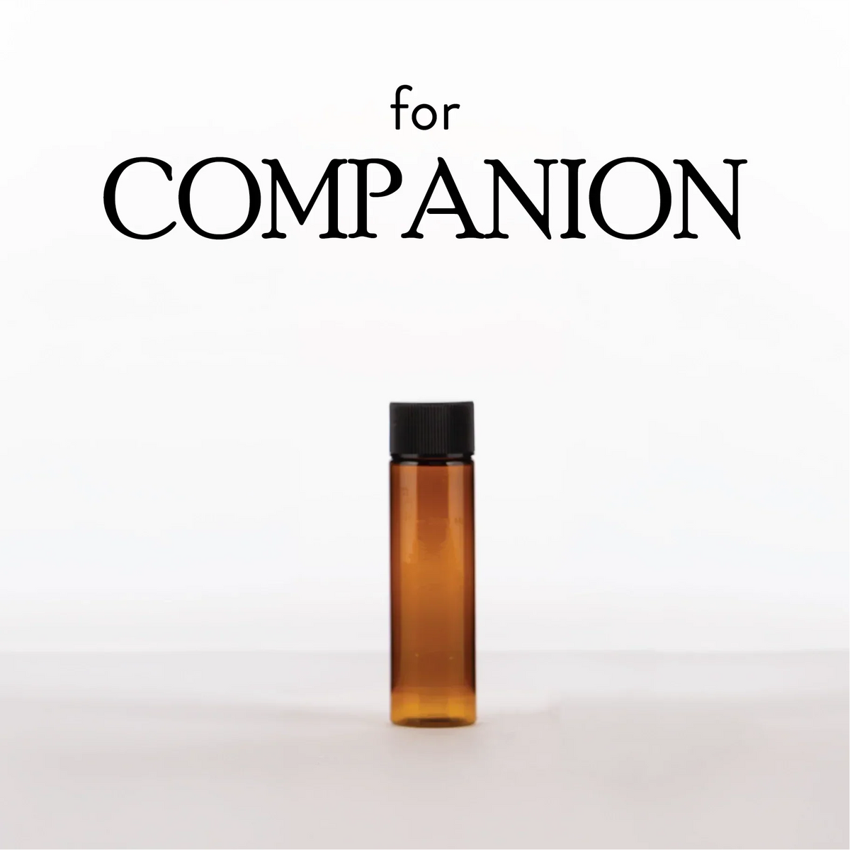 Empty Diffuser Bottle in a slim amber glass vial with a black screw cap for Companion diffuser refills