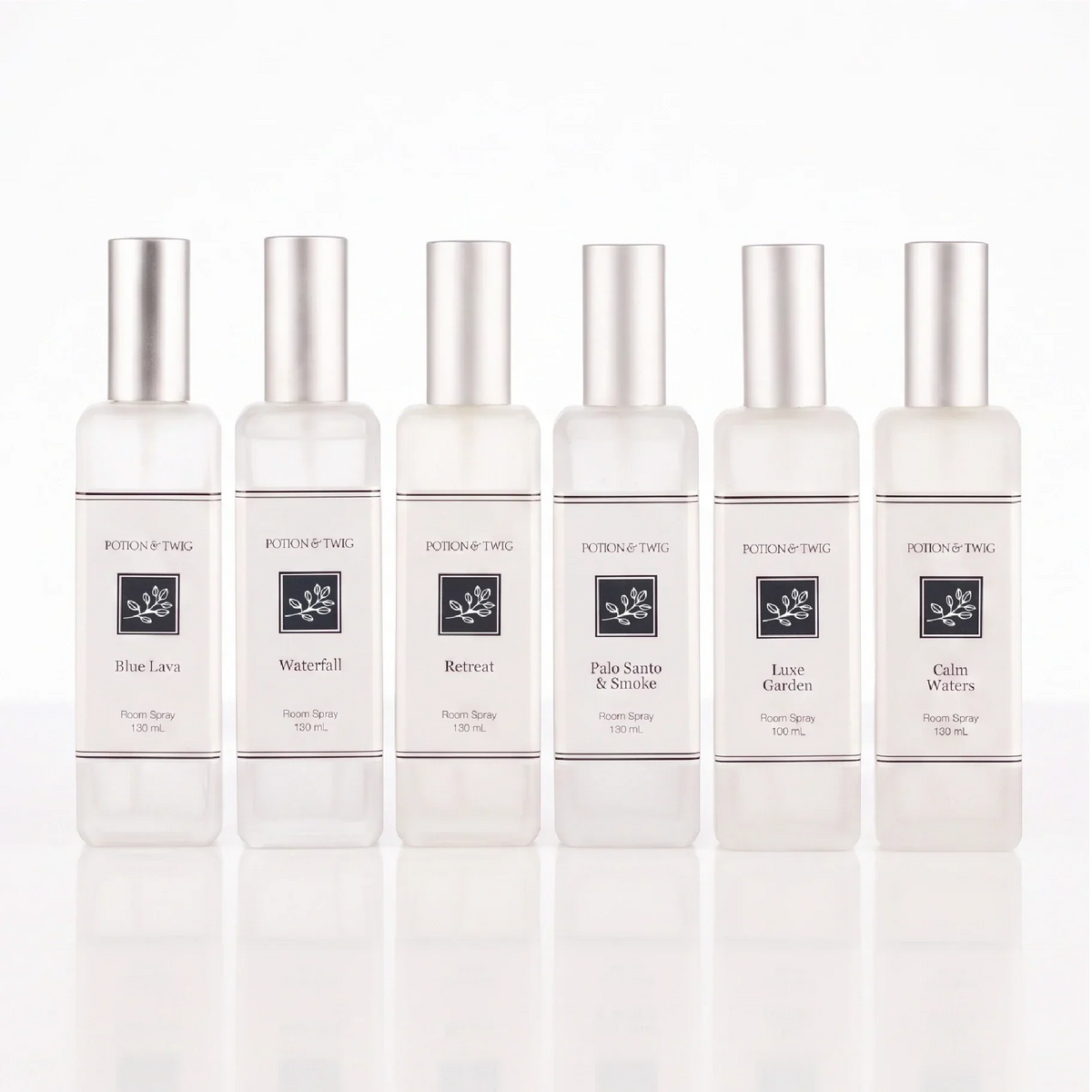 Luxury Room Spray in clear glass bottles with silver caps and minimalist labels in assorted fragrance varieties