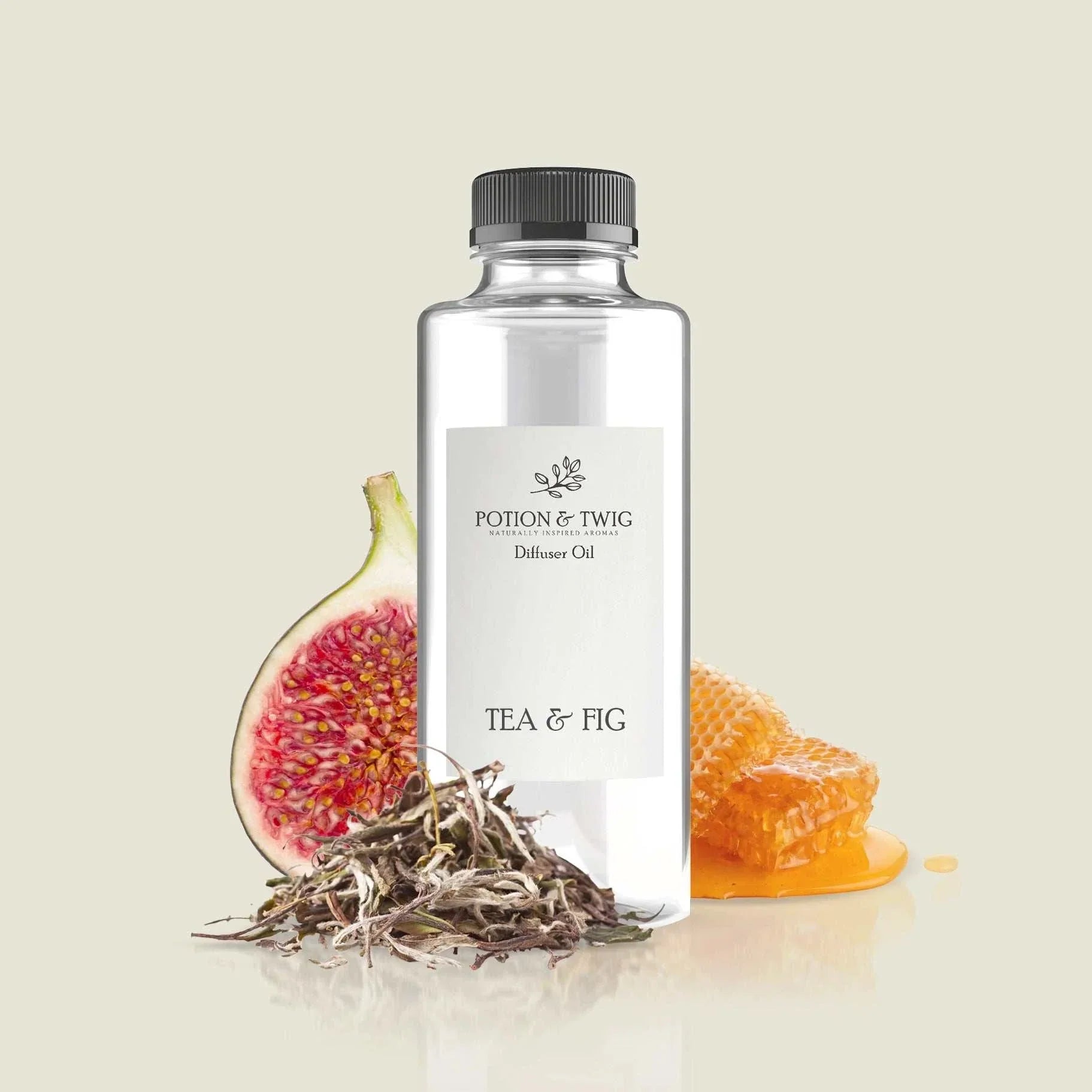 Close-up of lush fig beside white tea leaves representing Tea & Fig fragrance