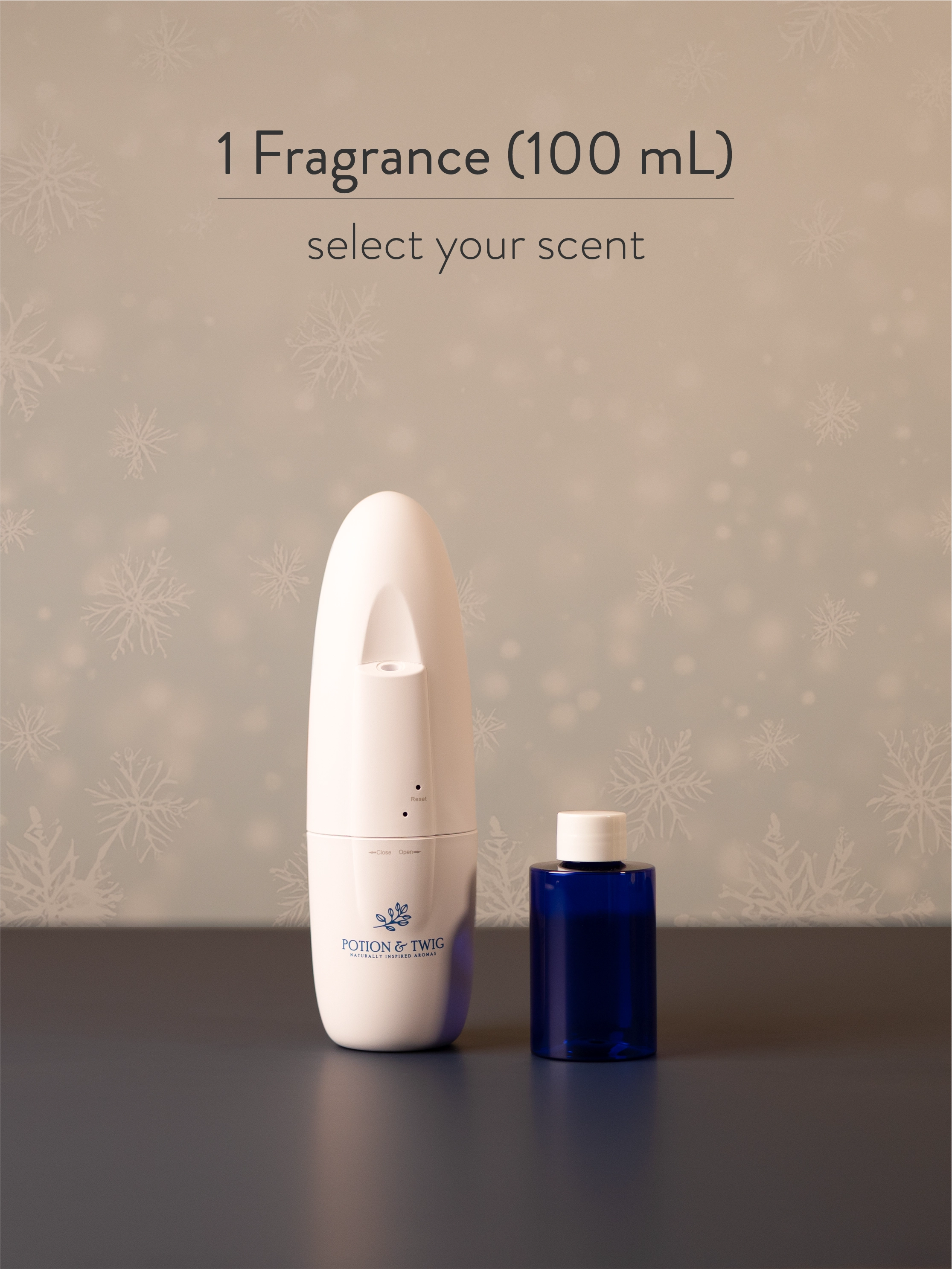 White Sienna scent diffuser next to a bottle of fragrance oil. 