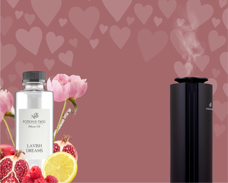 Lavish Dreams diffuser oil next to Spire diffusers with flowers and fruits on a heart-patterned background