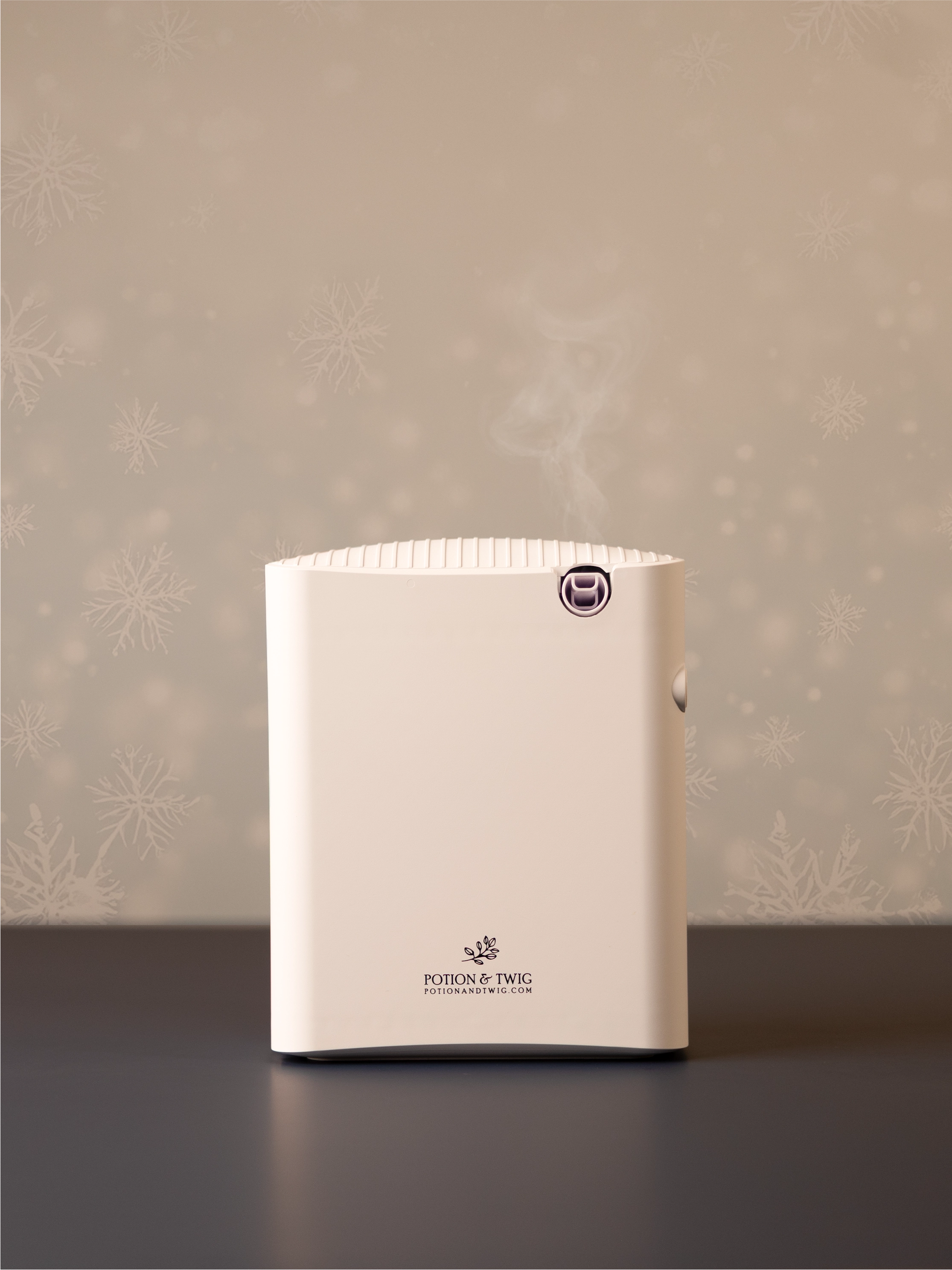 White square shaped scent diffuser on light neutral background