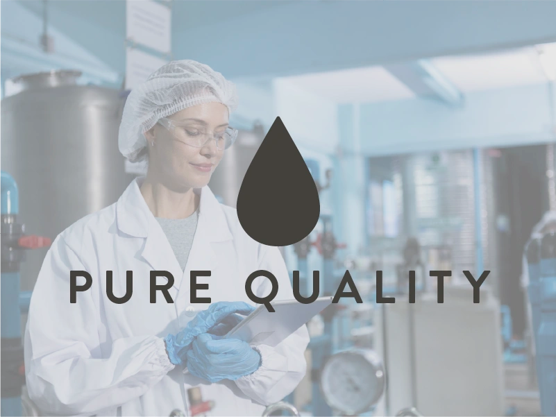 Person in a lab coat with 'Pure Quality' text and logo in a laboratory setting