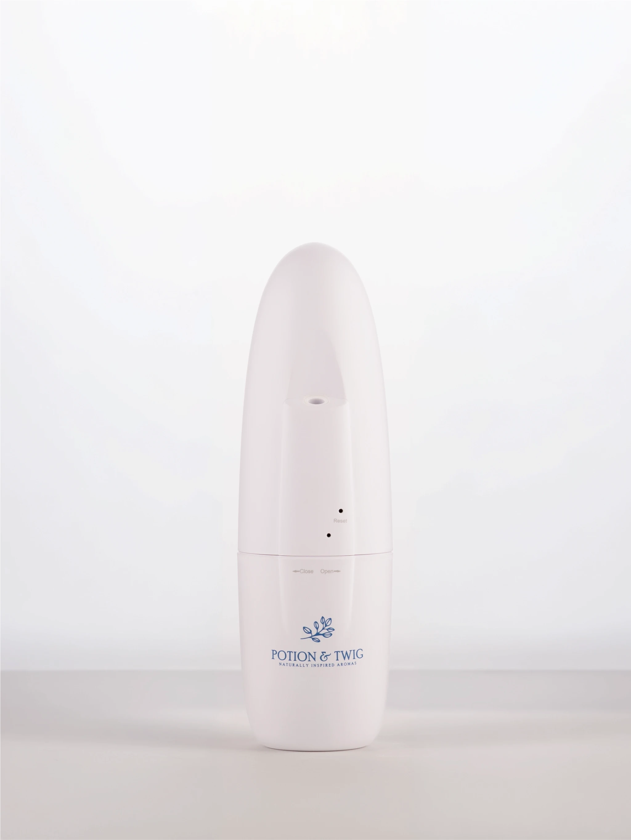 White cylindrical wall plug in diffuser with a logo on a white background