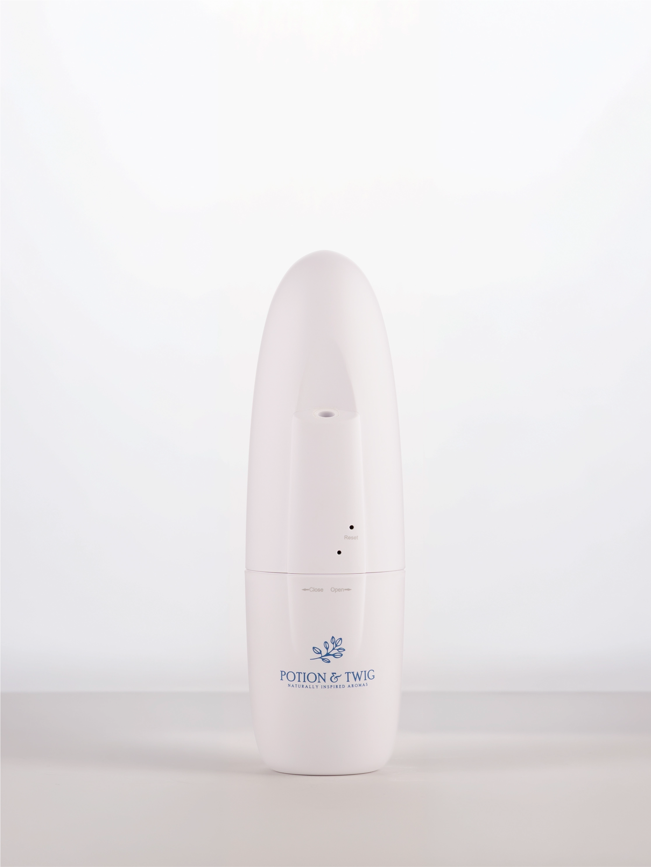 White cylindrical wall plug in diffuser with a logo on a white background