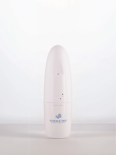 White cylindrical wall plug in diffuser with a logo on a white background