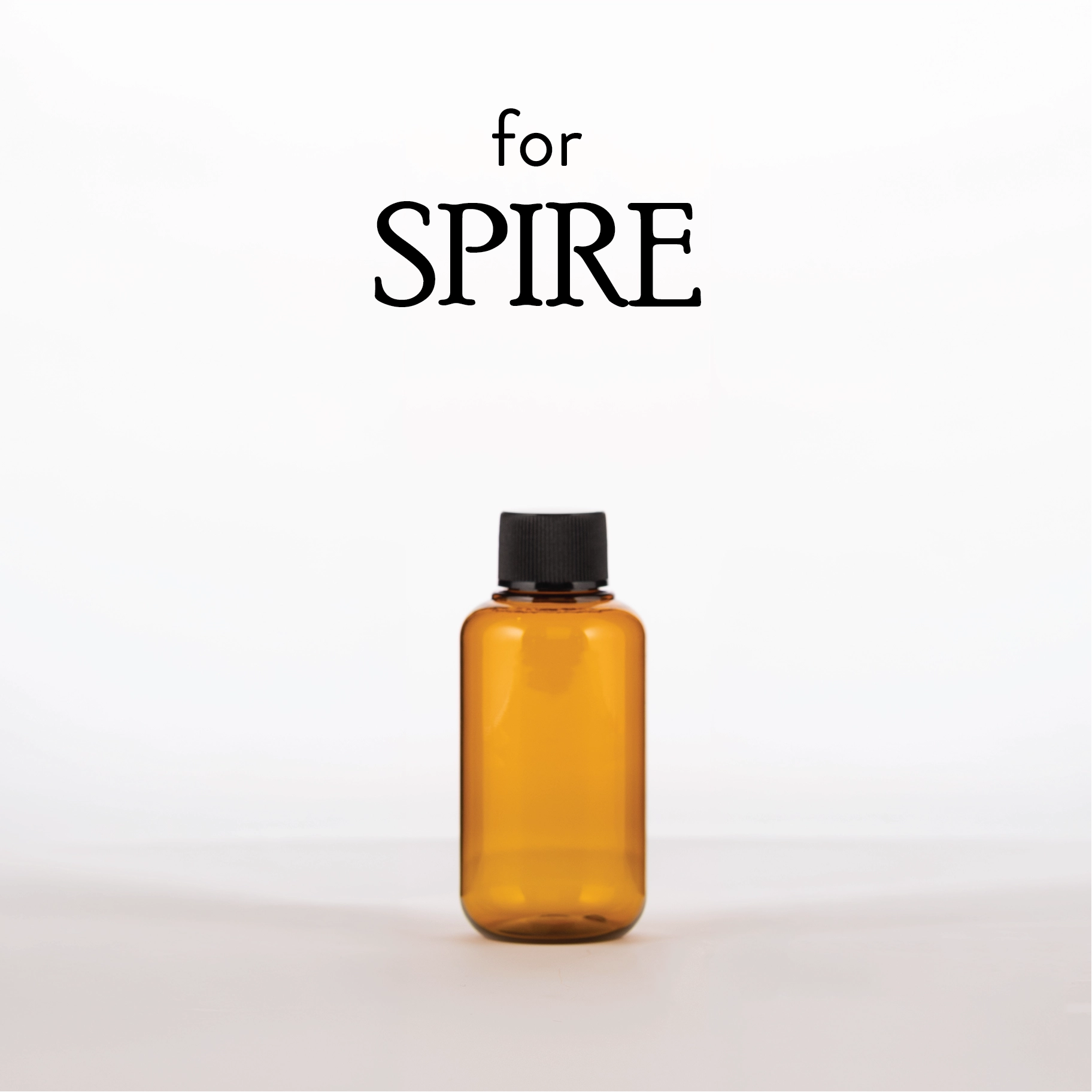 Amber bottle with black cap on a white background, featuring the brand 'SPIRE'.