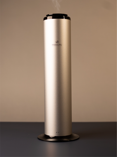 Tall cylindrical Terra scent diffuser on light neutral background