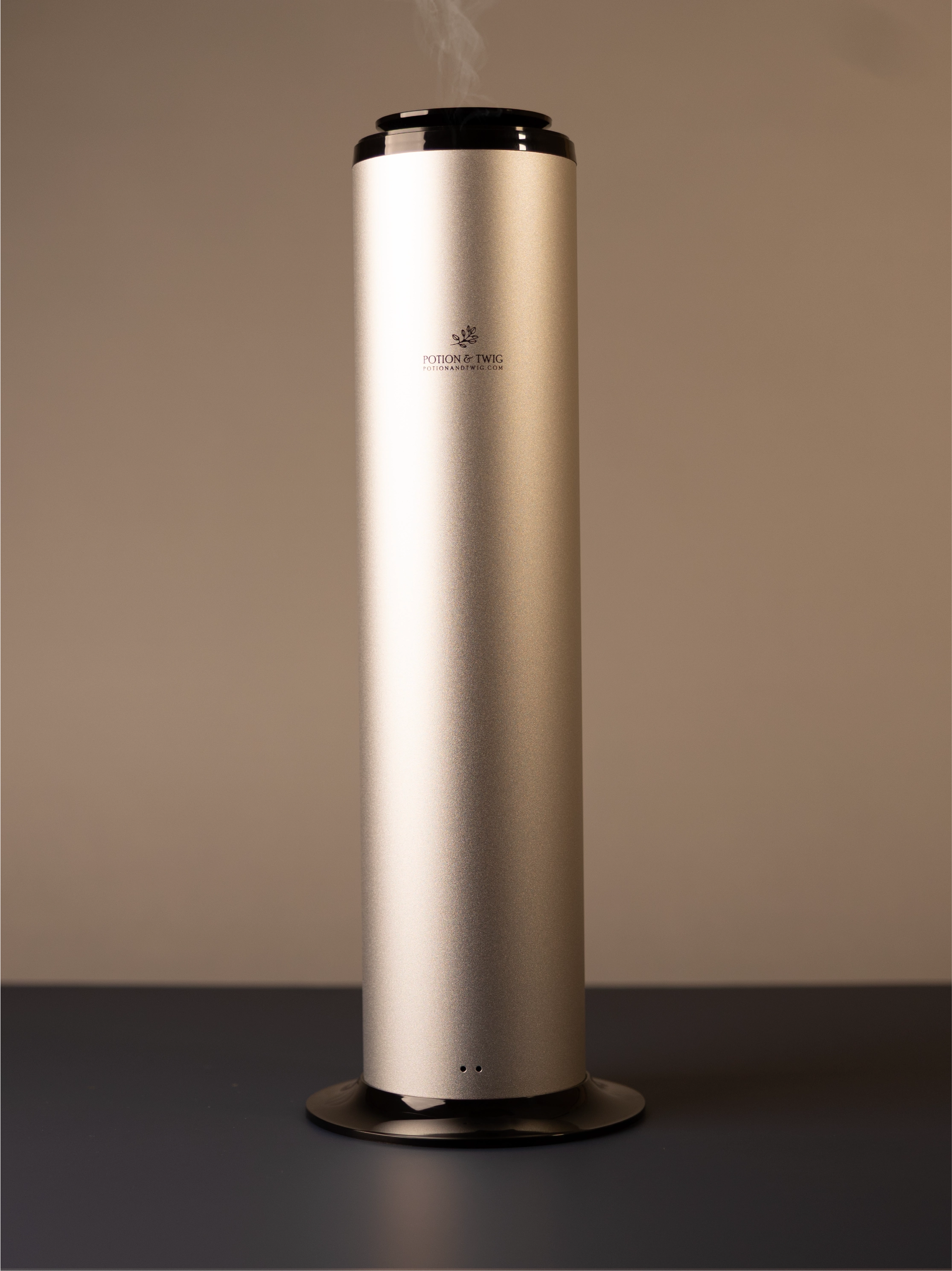 Tall cylindrical Terra scent diffuser on light neutral background