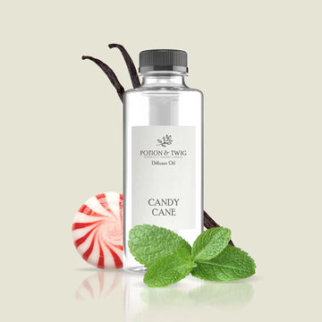 Close-up of a red and white striped candy cane with peppermint and spearmint essence
