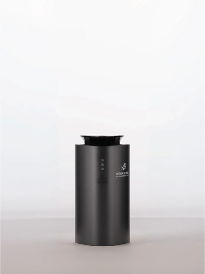 Companion Diffuser in matte black with a cylindrical body, top opening, and small front control buttons