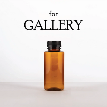 Empty Diffuser Bottle in translucent amber glass with a black screw cap and subtle measurement markings