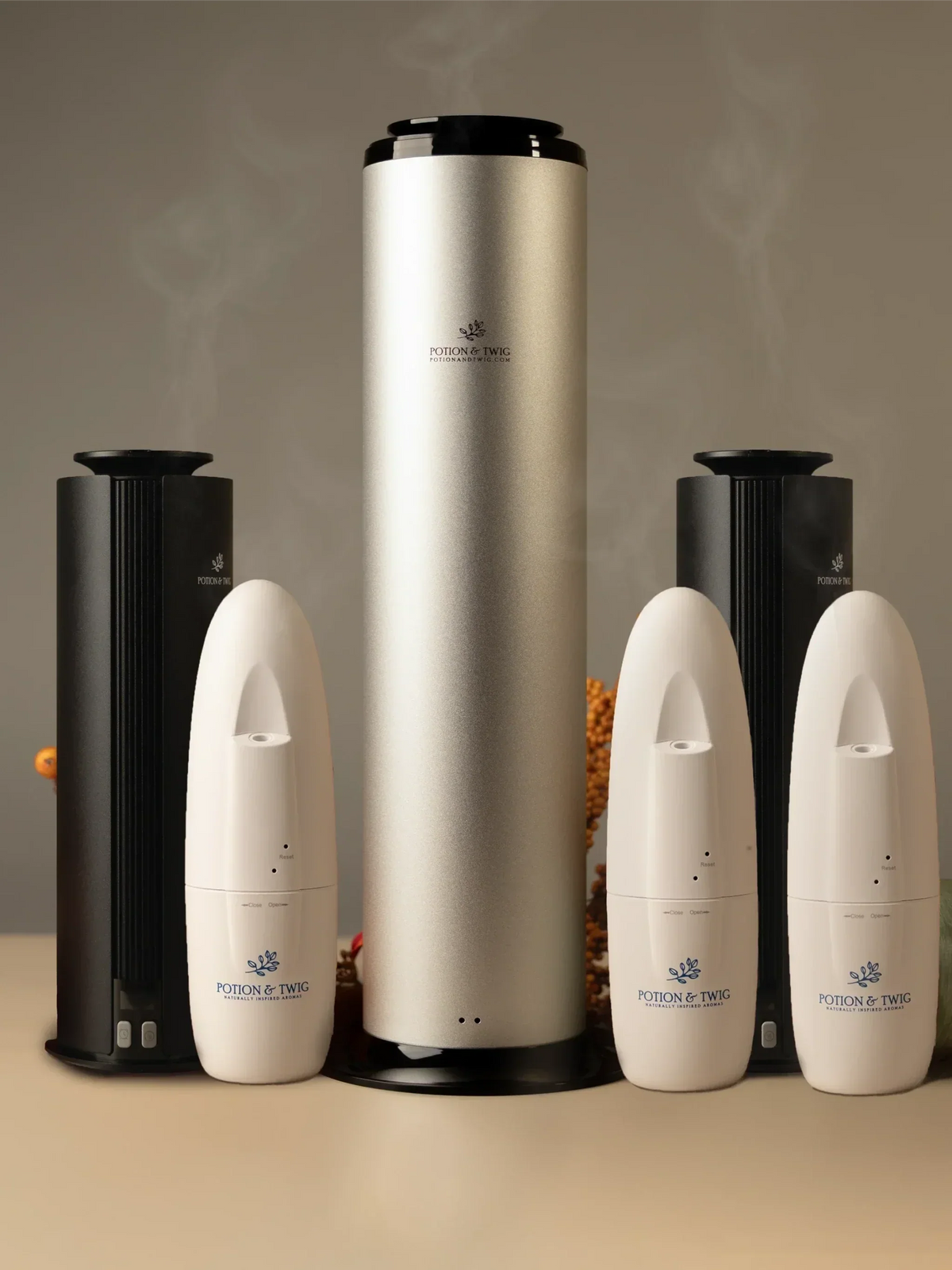 Extra Large Home Bundle with five fragrance diffusers in black, ivory and champagne metallic finishes, featuring sleek cylindrical and tapered designs