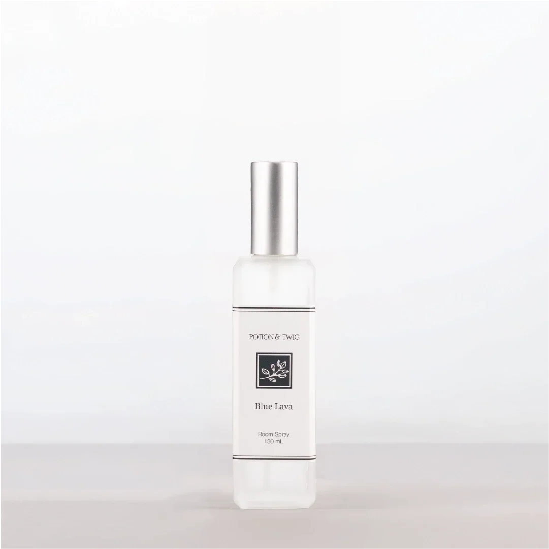 Luxury Room Spray in a clear bottle with a silver cap and minimalist white Blue Lava label