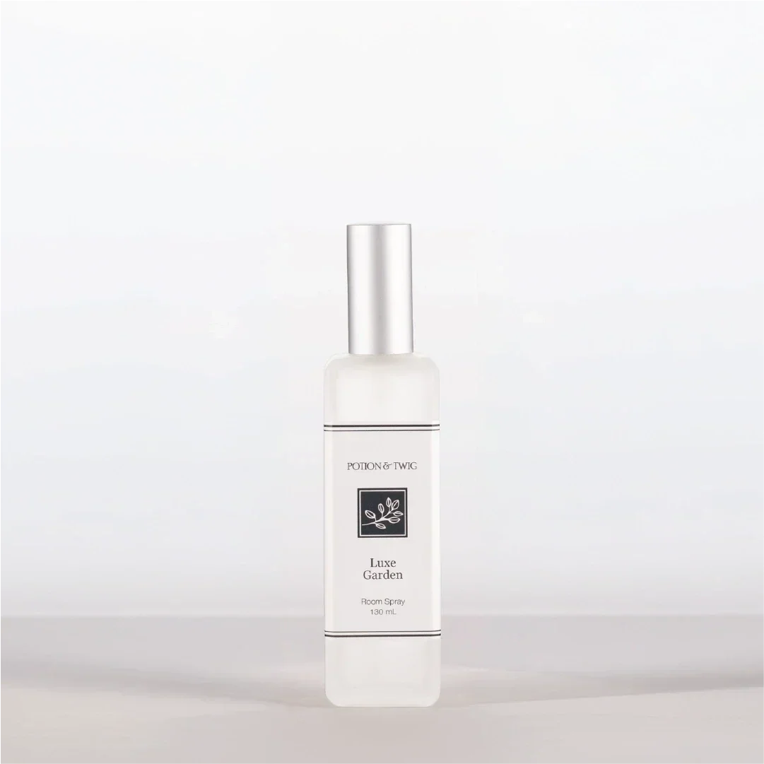 Luxury Room Spray in a clear glass bottle with a silver spray cap and minimalist white label
