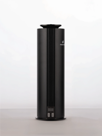 Spire Diffuser, a sleek black cylindrical aroma diffuser with a ribbed front panel and small base controls