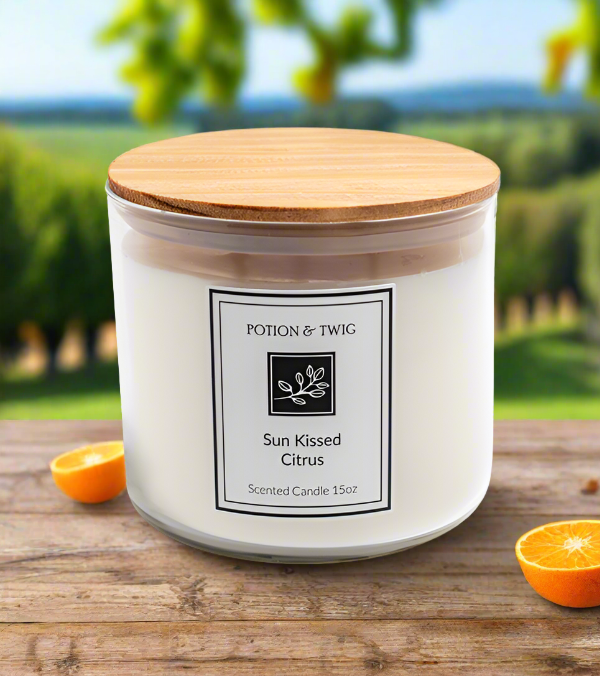 Sun Kissed Citrus candle in a white glass jar with a wooden lid and a black bordered label