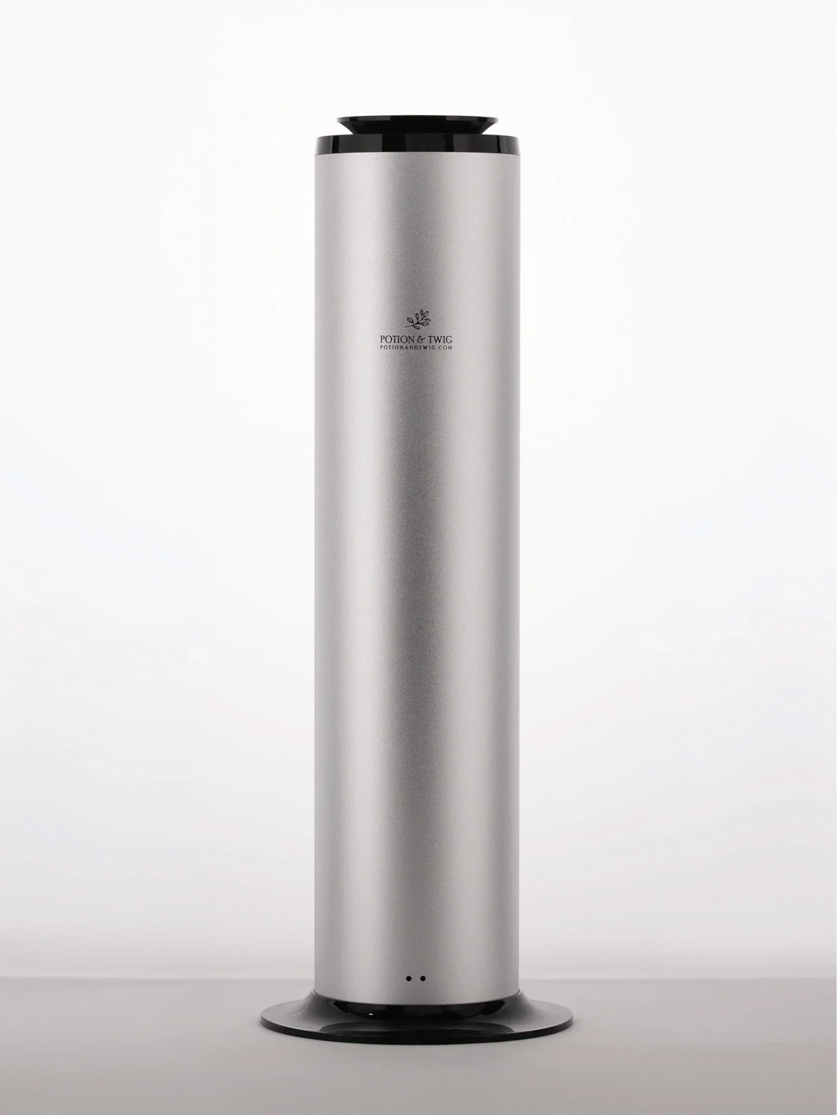 Terra Diffuser tower with a tall silver metallic cylinder, black top and round black base, with a sleek minimal design