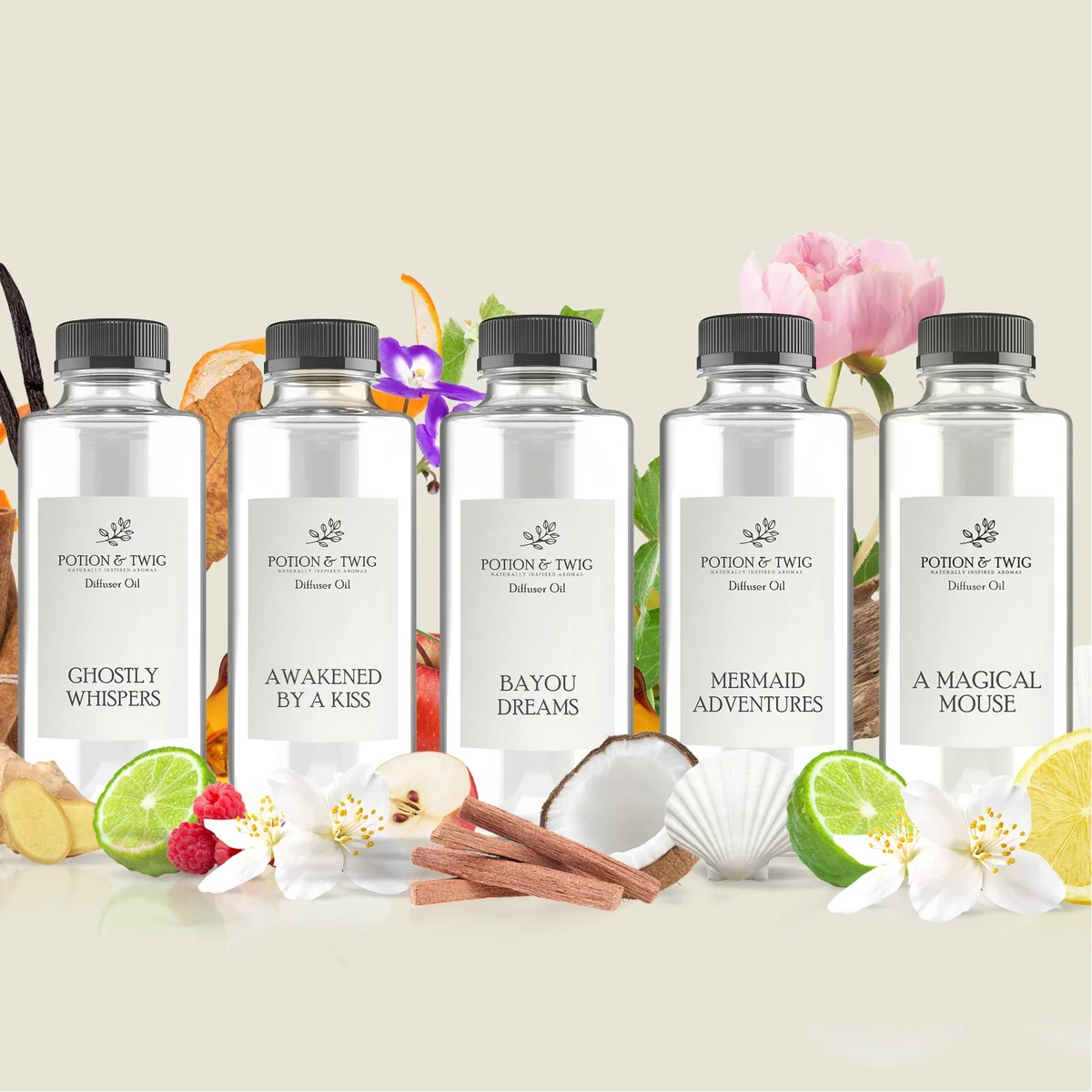 Theme Park Favorites essential oil set with five clear bottles and white labels, featuring floral and tropical scent names