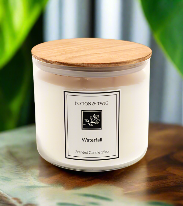 Waterfall 15oz. 3 Wick Candle in a white glass jar with a natural wood lid and minimalist botanical label